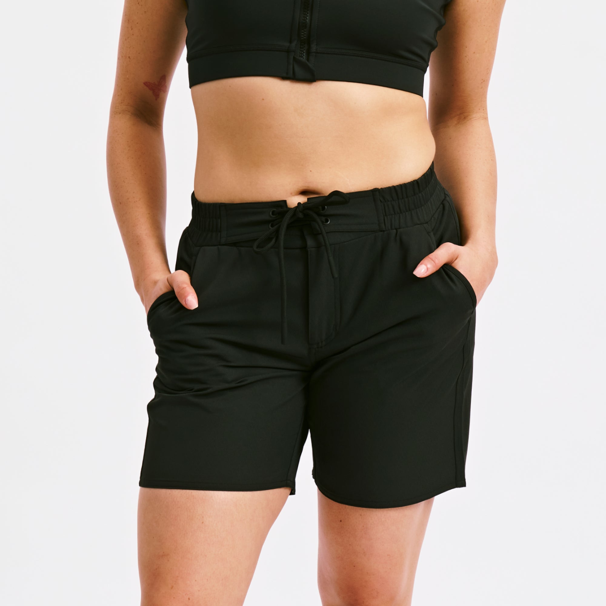 Model: Kia is 5' 7'' and wears a medium