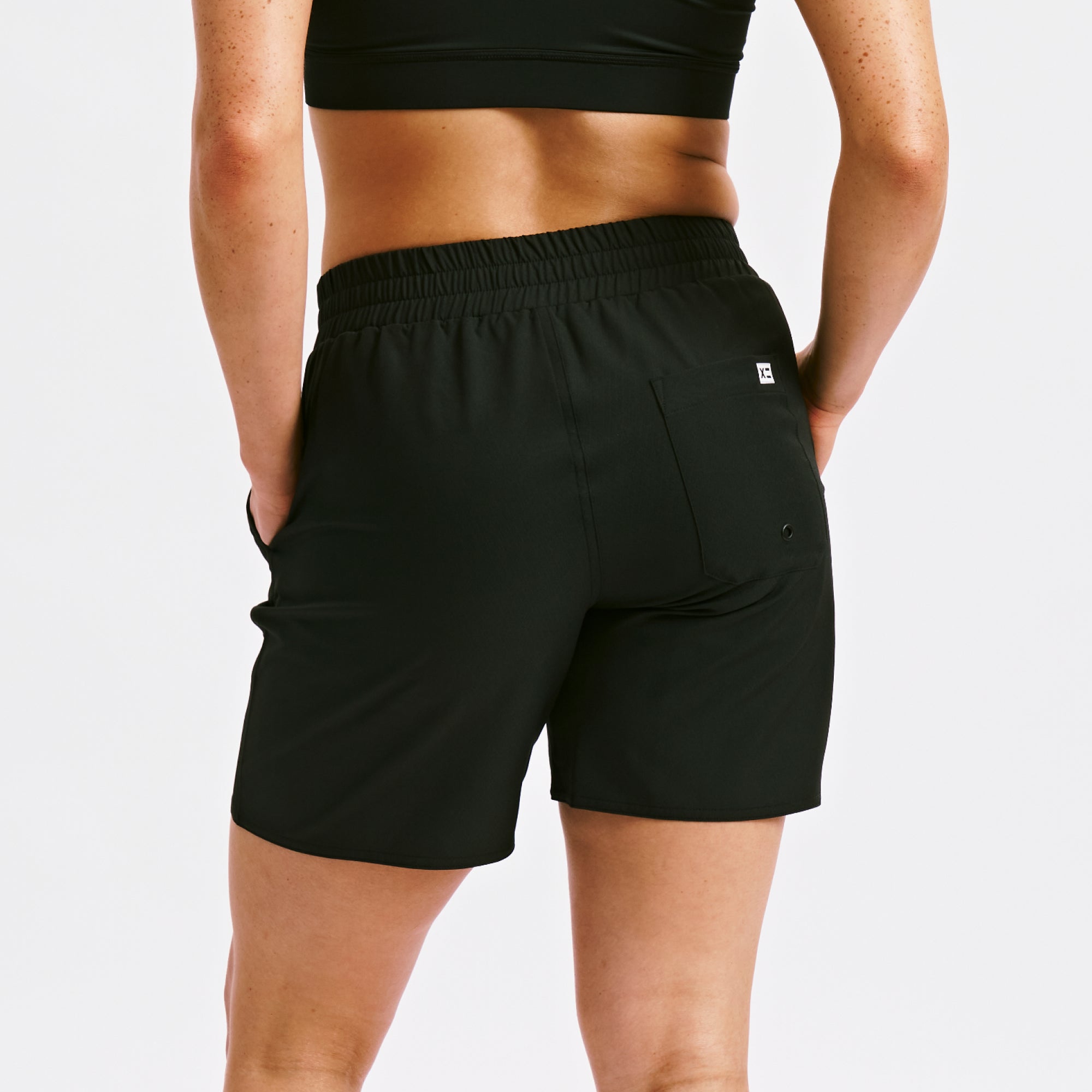 Model: Kia is 5' 7'' and wears a medium