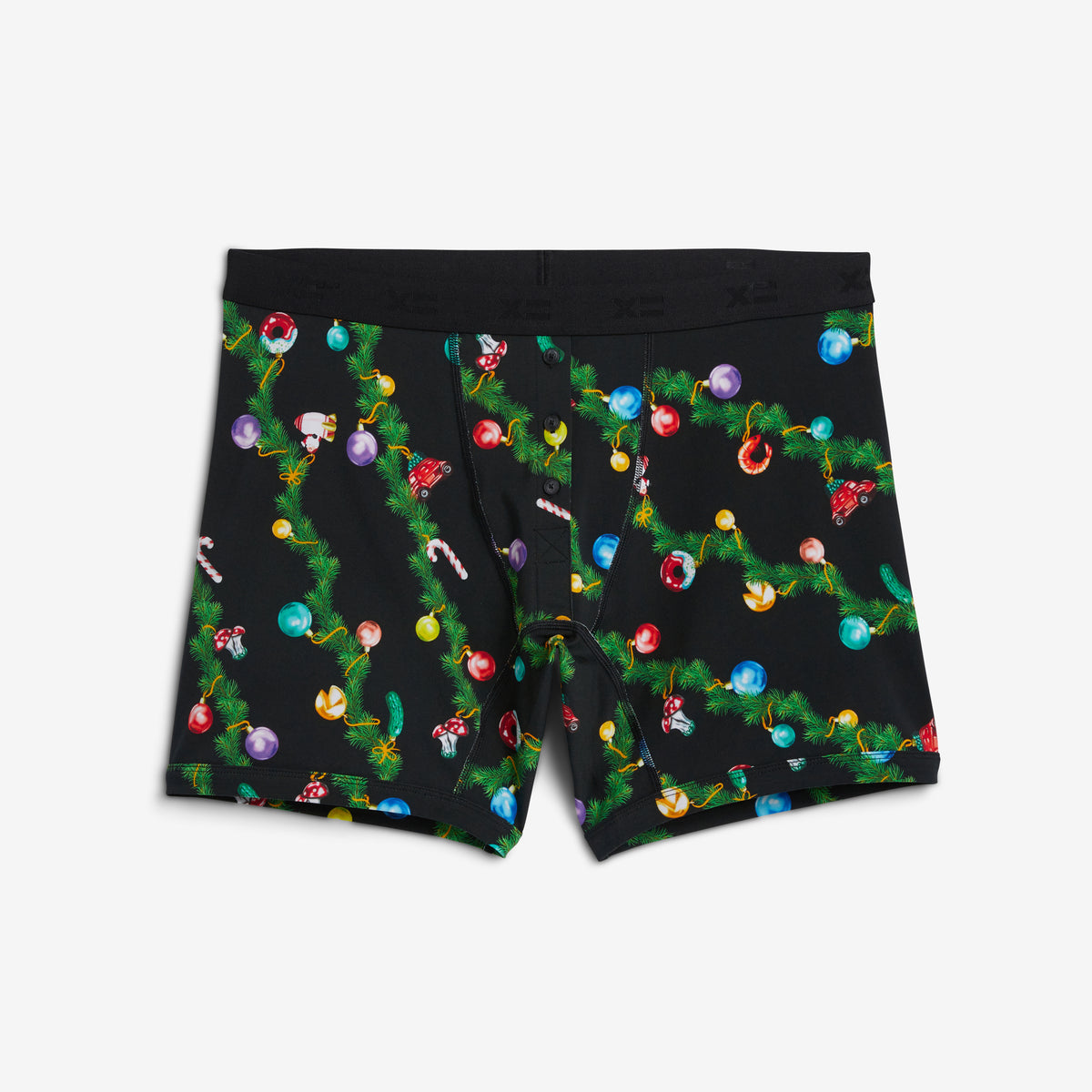 Black boxer briefs featuring a festive Christmas tree lights print with colorful ornaments, green pine branches, and candy canes, shown flat on a light gray background.